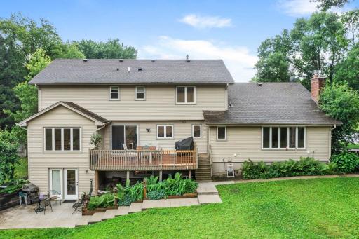 Walkout basement with concrete patio and deck space.
