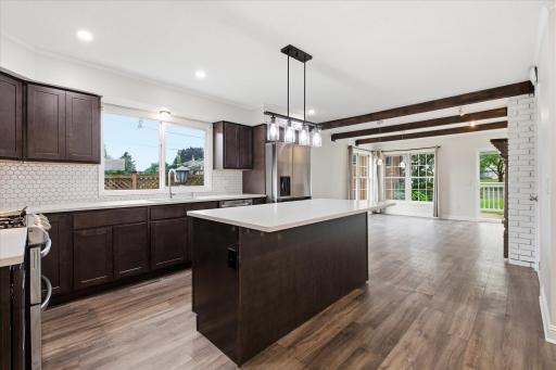 The open-concept layout offers seamless flow and is perfect for entertaining!