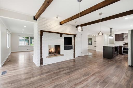Character-rich details like exposed beams and the fireplace add warmth and personality!