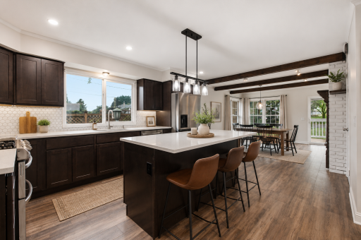 The spacious kitchen with ample cabinetry and counter space makes meal prep and entertaining effortless!