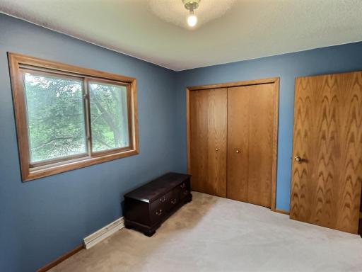 This bedroom offers a nice size closet and view to the backyard.