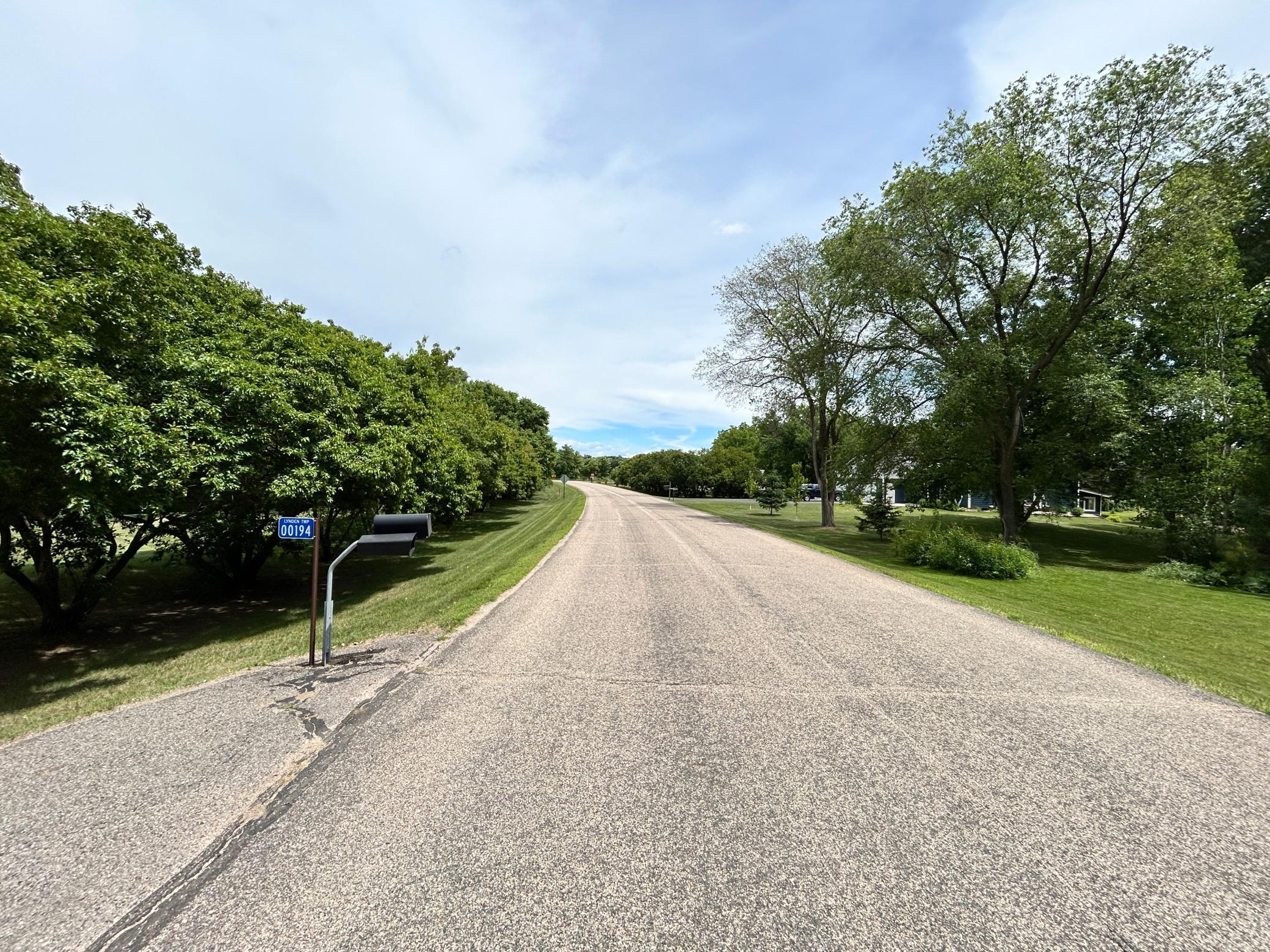 Entry to this quiet neighborhood is paved streets.