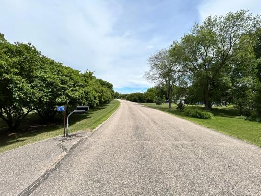 Entry to this quiet neighborhood is paved streets.