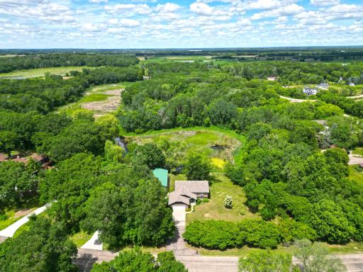 This view show the piecefull setting with mature woods and pond in the rear of the property.