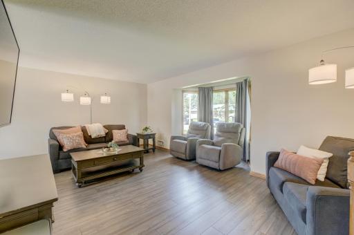 Beautifully updated throughout with fresh paint, new flooring, updated fixtures, and stylish finishes
