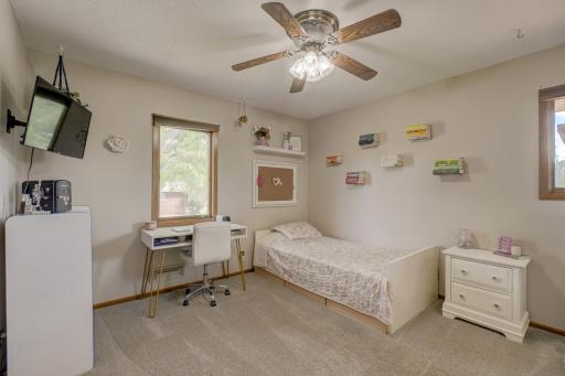 This third bedroom in the upper level provides comfort and privacy