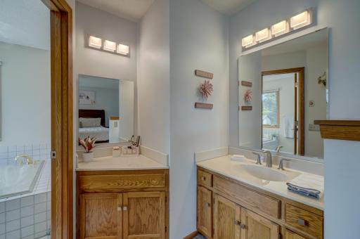 Private primary bath featuring a separate tub and showerâdesigned for ultimate relaxation and a spa-like experience!