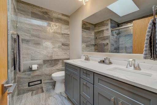 Fully renovated upper-level bathroom showcasing stylish modern updates