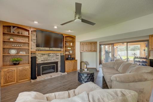 Cozy up by the fireplace in the spacious and bright family room, perfect for relaxing year-round!