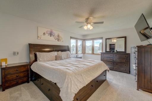 Unwind in the private primary suite showcasing an abundance of natural light, a walk-in closet and ensuite bathroom!