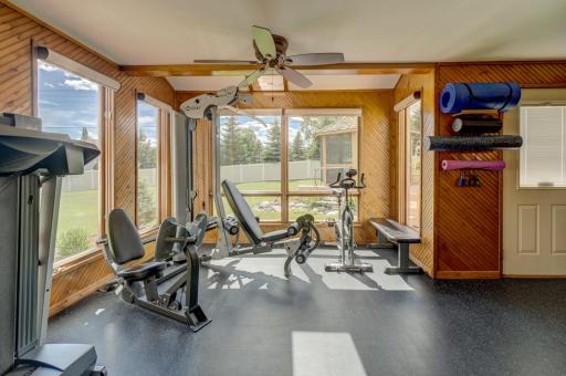This versatile four-season porch can easily transform into a sunroom, home office, playroom, or hobby space
