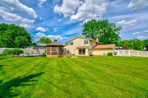 Extended driveway and storage pad provide additional parking and storage flexibility