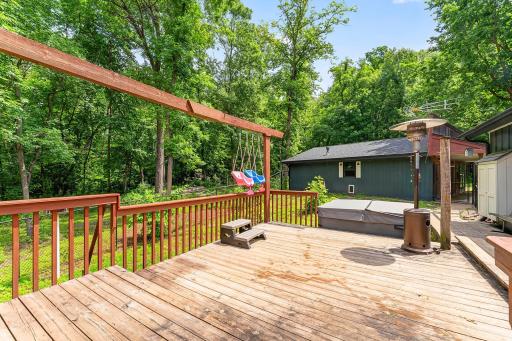Wood deck to the backyard and neighboring large, dense, mature forest