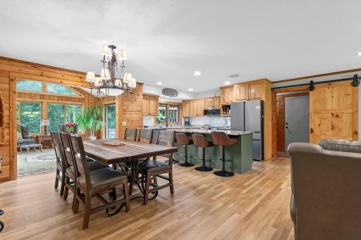 Dining room into kitchen and 4-season porch