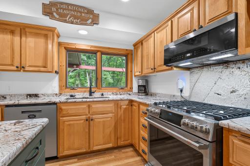 Café brand luxury Platinum Glass appliances, cohesive granite range wall backsplash
