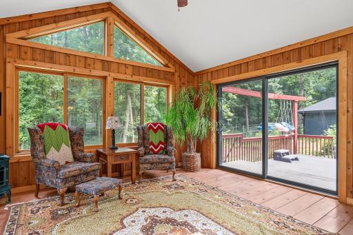 4-season room with access to deck via sliding glass door