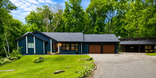 Home and front yard, attached 2-car garage, detached shop setback to the right
