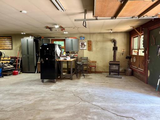 Insulated shop/garage w/LP heat and wood burning stove.