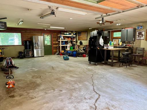 Insulated shop/garage w/LP heat and wood burning stove.