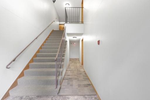 Secure building entry with a bright and well-maintained common area.