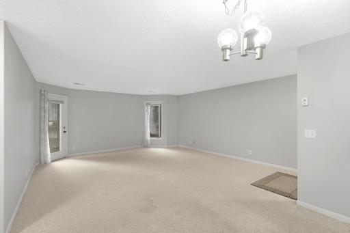 Spacious living room with plenty of room to relax, entertain, and make your own.