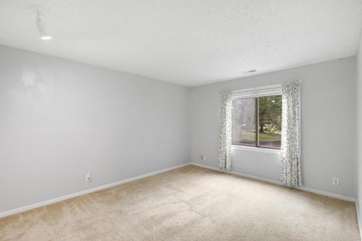 Spacious 2nd bedroom offering flexibility for guests, a home office, or hobbies.