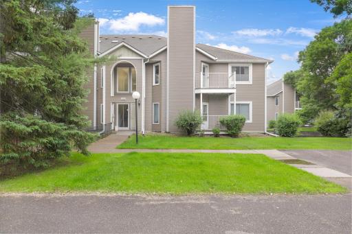 Attractive exterior nestled among mature landscaping and shade trees.