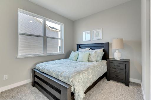 Third bedroom of three total. Model home, finishes will vary.