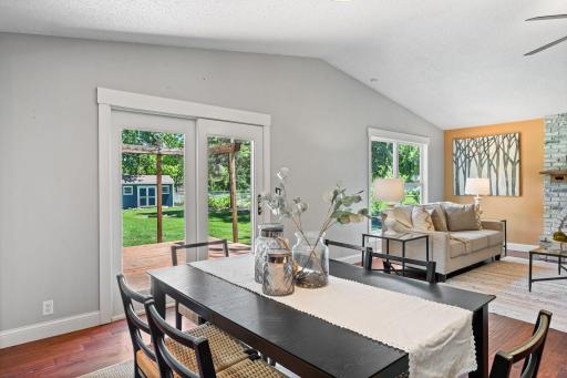 Dining room offers great views of the backyard through the patio doors and opens to the living room