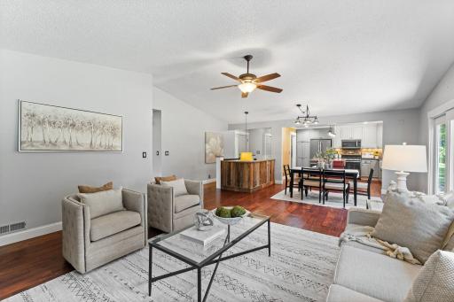 Enjoy vaulted ceilings and a ceiling fan over the living and dining room