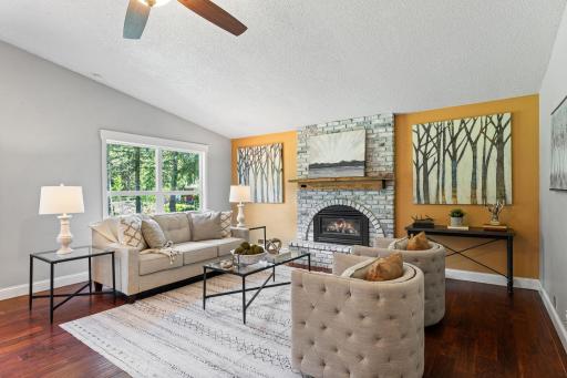Cozy living room centered around a brick fireplace