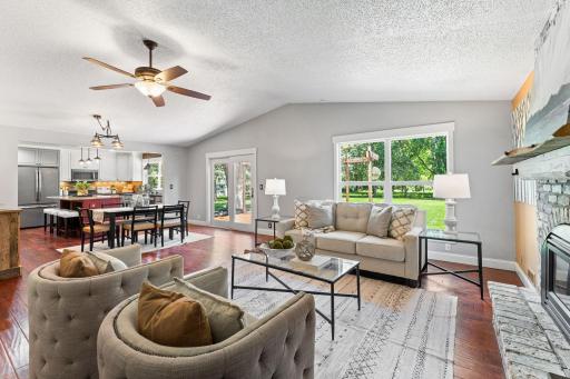Enjoy the open concept living space, complete with hardwood floors throughout