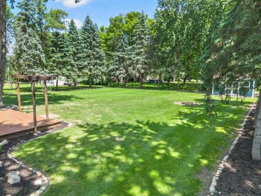 Backyard is beautifully landscaped and offers a quiet retreat amongst the trees