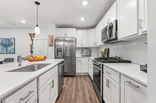 14909 Archdale Lane_Floor-to-ceiling cabinetry and a smart layout make this kitchen as practical as it is pretty.