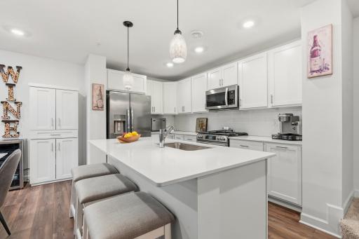 14909 Archdale Lane_Pull up a stool. This island seats a crowd and keeps the cook in on the conversation.