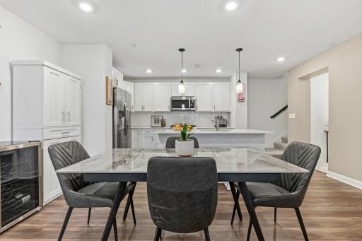 14909 Archdale Lane_Where the everyday happens. A clean, bright kitchen opens to a dining space that's ready for weeknight dinners or Sunday brunch.