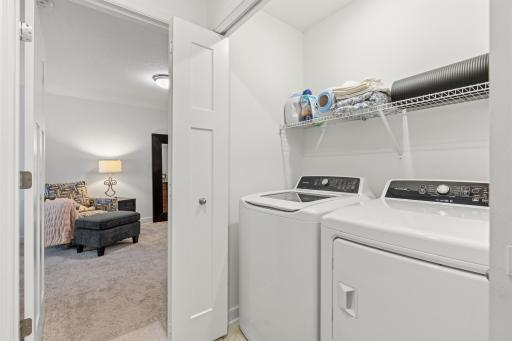 14909 Archdale Lane_Laundry day, simplified â a dedicated space that keeps the essentials close and clutter contained.