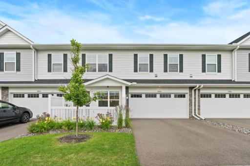 14909 Archdale Lane_Curb appeal that doesn't try too hard. Fresh landscaping, a young shade tree just getting started, and a two-car garage that means no more fighting for driveway space.