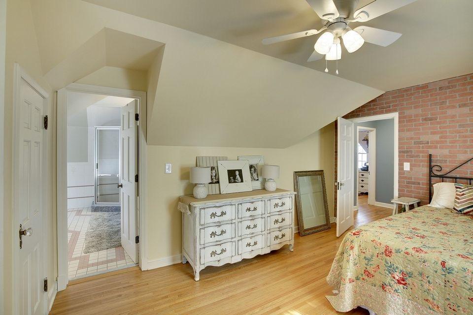 View into primary bathroom w/ full jacuzzi tub, full shower, and double vanity