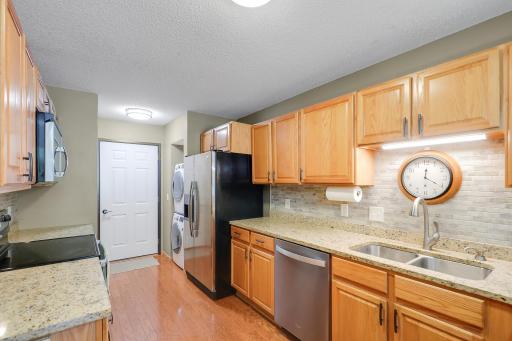 Kitchen with new countertops amd backsplash.