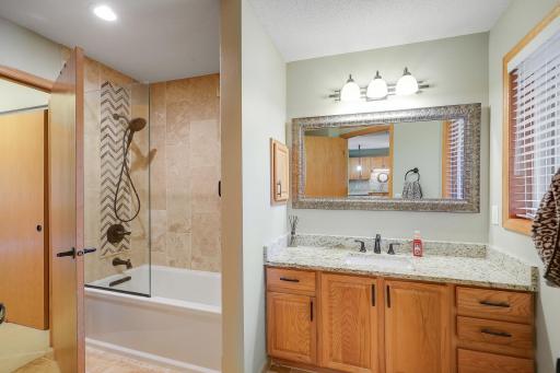 Full bath off primary bedroom with combination tub/shower. Excellent size vanity area.