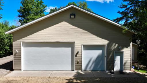 40x40 Outbuilding Complete with In Floor Heat, AC, and supplemental heating as well. This 2x6 Framed and insulated building is the ultimate space to suit whatever need you find fit for it! 10x12 shed with concrete floor and electrical right next door