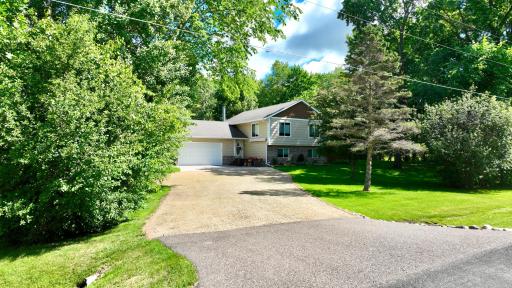Driveway Leading into the Home Features a crushed limestone main drag, finished off with a large concrete apron in front of the home.