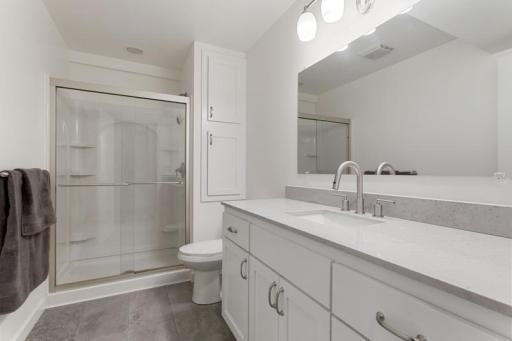 3/4 Bath Lower Level complete with solid surface countertop