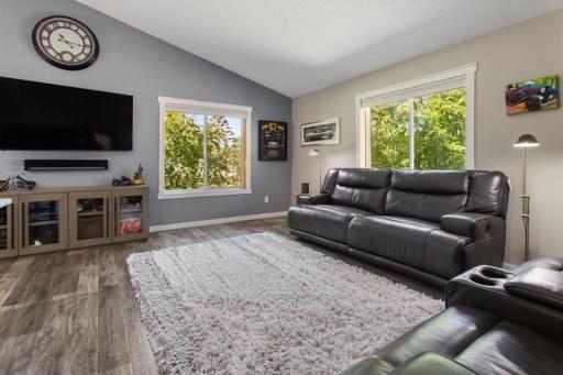 Living Room with Vaulted Ceiling provides an airy and open feel, the abundance of natural light shines through all the windows the upper level has to offer.