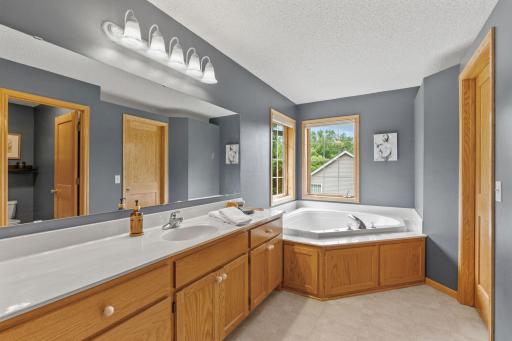 Spacious Primary Suite w/ private Bath, separate tub/shower & oversized walk-in closet.