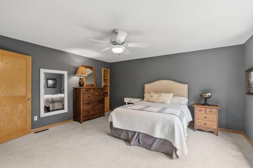 Spacious Primary Suite w/ private Bath, separate tub/shower & oversized walk-in closet.