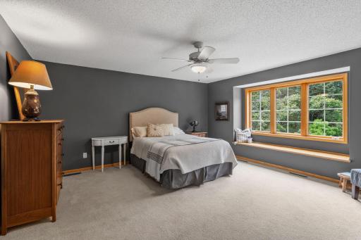 Spacious Primary Suite w/ private Bath, separate tub/shower & oversized walk-in closet.