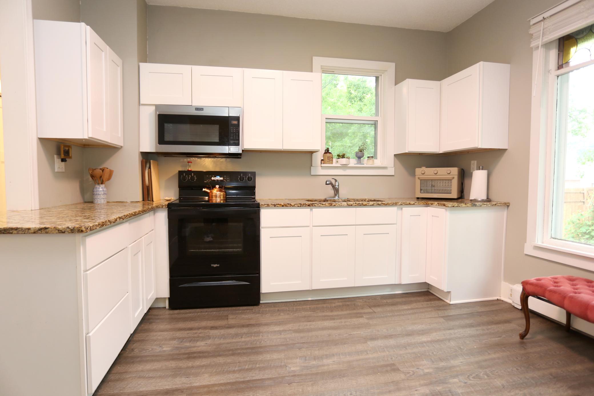 Plenty of Cabinet Space in This Bright Open Kitchen!