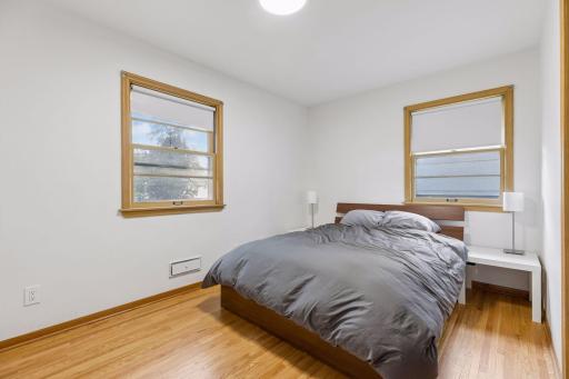 Primary bedroom with refinished hardwood floors